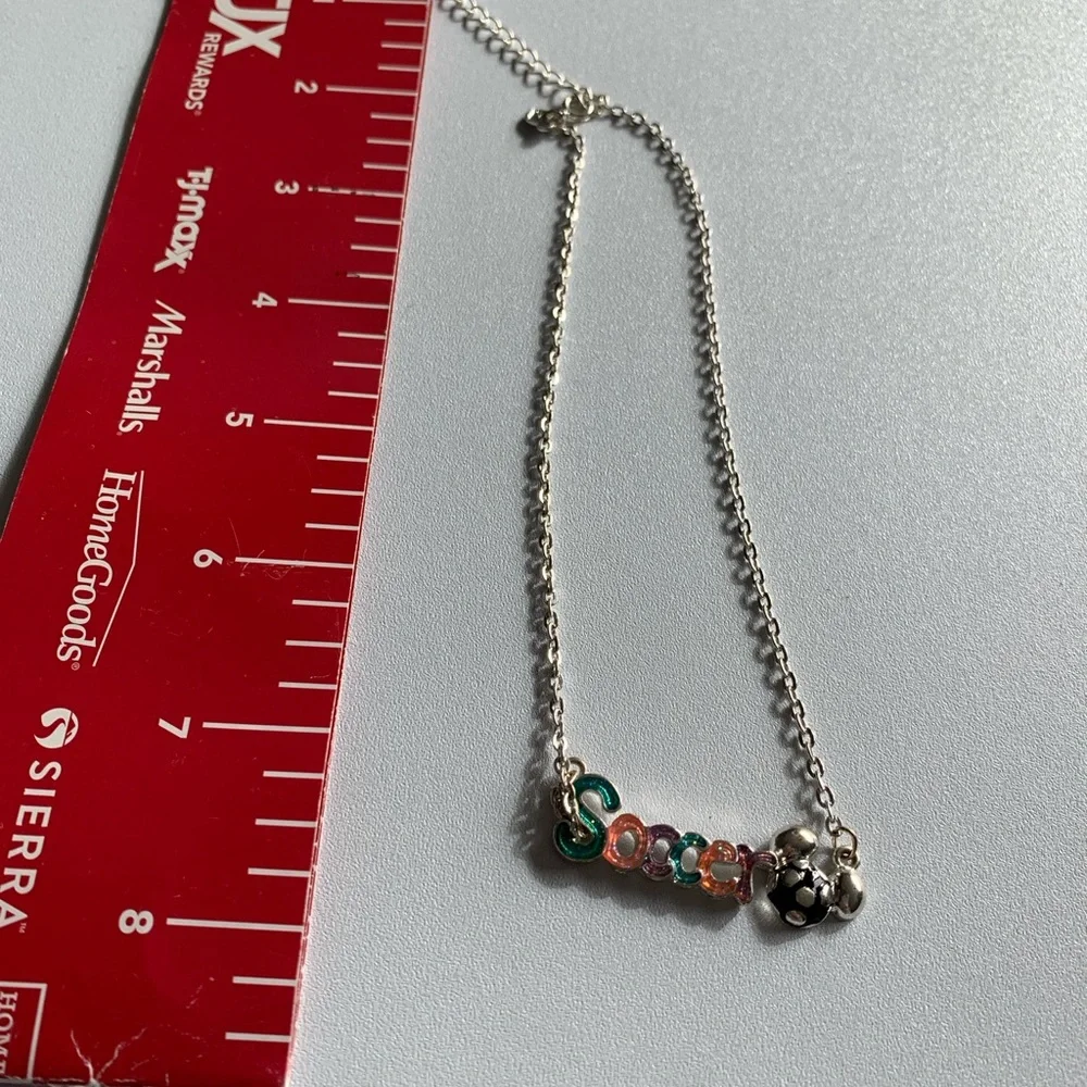 Disney girls soccer necklace.